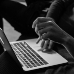 Woman on a laptop identifying agency relationships in business