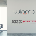 Office view of Winmo and Access Confidential's logo on the wall